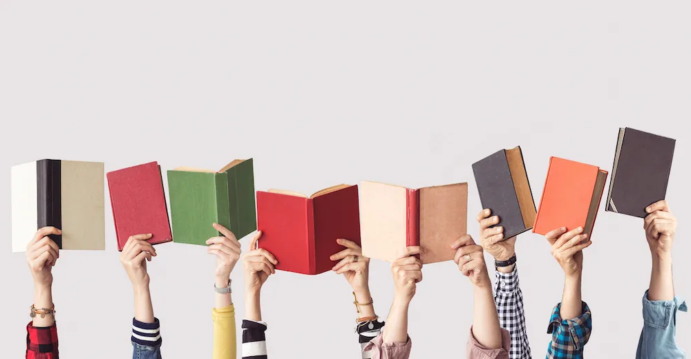 Books being held in the air